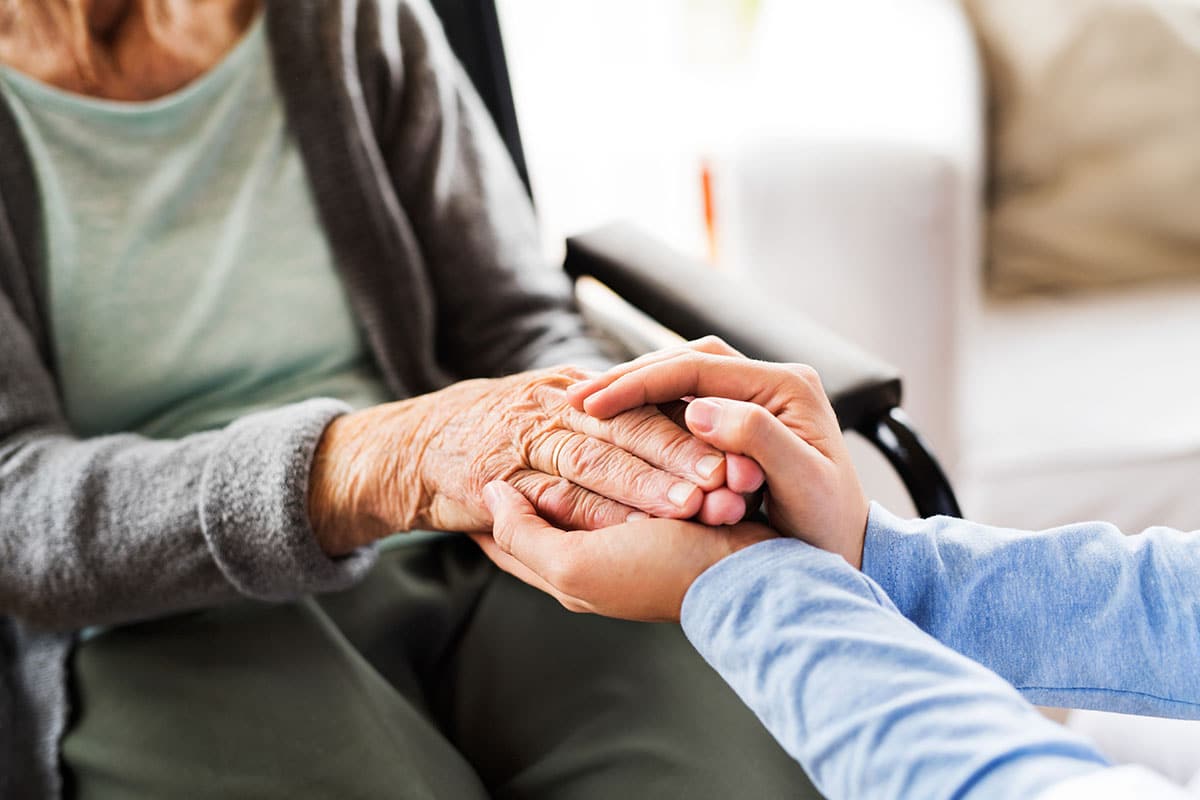 caregiver holding hands